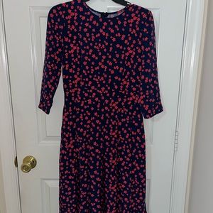 Pink floral and navy blue dress.